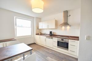 Η κουζίνα ή μικρή κουζίνα στο Nordsee Apartments