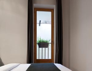 Posteľ alebo postele v izbe v ubytovaní Centric Gracia Apartments