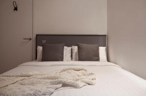 Posteľ alebo postele v izbe v ubytovaní Centric Gracia Apartments