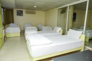 Ένα ή περισσότερα κρεβάτια σε δωμάτιο στο valparai villas