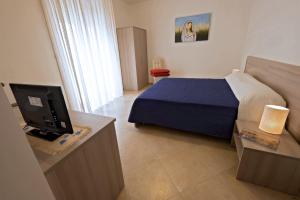 Postel nebo postele na pokoji v ubytování Monte Castello