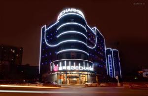 a large building with lights on it at night at Echarm Hotel Changsha Wuyi Square Xiangya Affiliated 1st Provincial Maternity and Child in Changsha