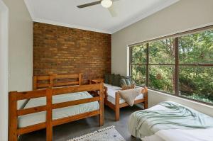 Ένα ή περισσότερα κρεβάτια σε δωμάτιο στο Hidden Grove