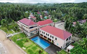 an aerial view of a house with a swimming pool at Baga Resort Hotel in Lagudri