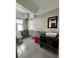 a bathroom with a sink and a toilet at Ana SonamTsomu, Tawang in Tawang