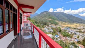a balcony with a view of the mountains at Vista Valley View homestay in Dirang Dzong