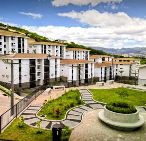a building with a park in front of it at Apartamento San Andrés 