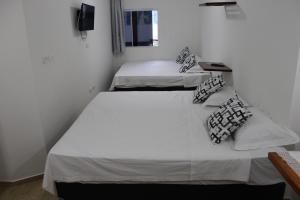 Postel nebo postele na pokoji v ubytování Hotel Reobot Center