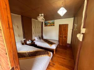 a small room with two beds in a room at Yensabai Bungalow River view in Nongkhiaw +23 photos