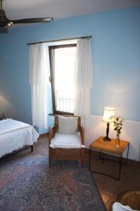 Een bed of bedden in een kamer bij L'Ancienne Auberge