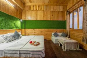 Ένα ή περισσότερα κρεβάτια σε δωμάτιο στο Moon Light Cottage