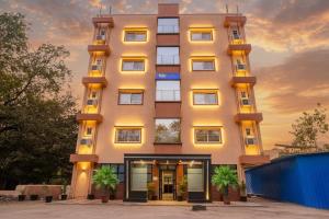 una representación de un edificio con una puesta de sol en el fondo en FabHotel Prime Esta Inn - Nr Twin Tower, Viman Nagar, en Pune