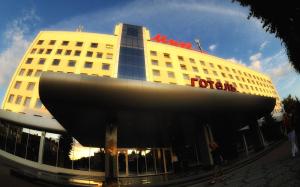 a building with a ford sign on the front of it at Hotel Mir in Rivne