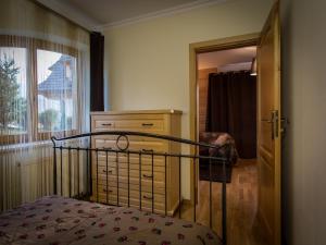 Posteľ alebo postele v izbe v ubytovaní Apartament w Góralskim Domu