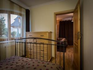 Ένα ή περισσότερα κρεβάτια σε δωμάτιο στο Apartament w Góralskim Domu
