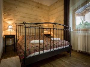 Posteľ alebo postele v izbe v ubytovaní Apartament w Góralskim Domu