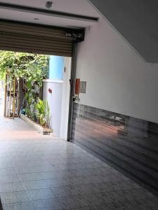 an empty garage with a sliding glass door at Cát Tường Homestay in Danang