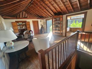 a view of a living room with a wooden ceiling at Große Finca 19Jh, Pool, Terrasse, nahe Santa Cruz in Santa Cruz de la Palma