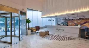 a lobby of a hotel with a reception desk at Jinjiang Inn Style Ningbo Railway Station in Ningbo