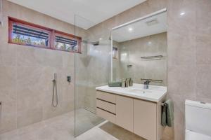 a bathroom with a sink and a glass shower at The Haven Montville in Montville +44 photos