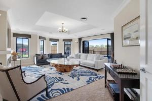 a living room with a couch and a table at Luxury Mansion 7bdrm 6bth pool pizza ovn 25mns CBD in Silverdale