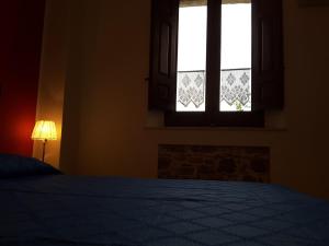 Postel nebo postele na pokoji v ubytování Casa nel Vigneto Erice