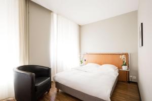 Postelja oz. postelje v sobi nastanitve GLANDON Rooms Elite