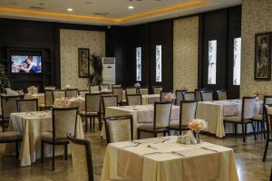 A restaurant or other place to eat at Grand Asya Hotel