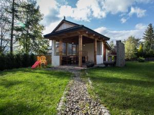 Vonkajšia záhrada v ubytovaní Apartament w Góralskim Domu