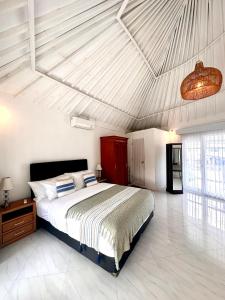 Postel nebo postele na pokoji v ubytování Wangi Melati Homestay