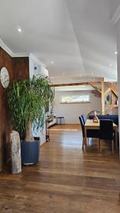 a room with a table and a clock on the wall at Penthouse-Feeling MaBeA in Innsbruck