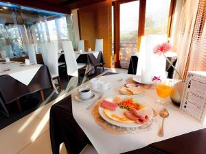 a plate of food on a table in a restaurant at The Residence Airport & Spa Hotel in Bangkok