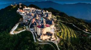 an aerial view of a castle on a mountain at Ocean View Danang Hotel in Da Nang
