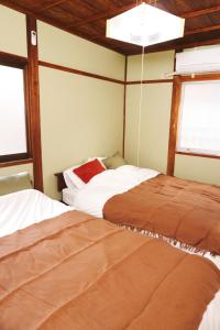 Ένα ή περισσότερα κρεβάτια σε δωμάτιο στο Cozy Fukui