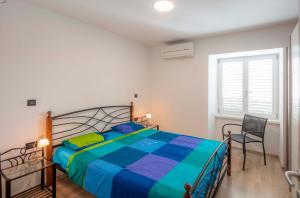 Posteľ alebo postele v izbe v ubytovaní Apartments Villa Adrienne