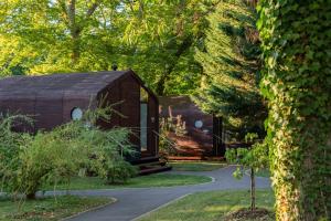 a small house in the middle of a forest at Domaine de la Résidence - Hôtel, Spa & Restaurant in Moulins-lès-Metz