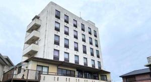 a tall white building with windows on top of it at Inuyamakan in Inuyama +17 photos