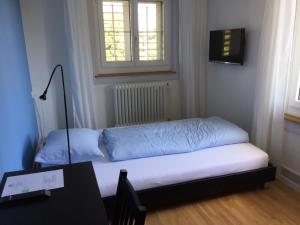 Postel nebo postele na pokoji v ubytování BnB Hopfengrün Langenthal