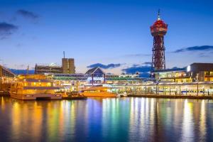 a harbor with boats in the water at night at ロジュマン博多 in Hakata