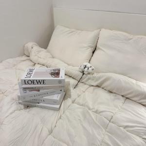 Ένα ή περισσότερα κρεβάτια σε δωμάτιο στο 코튼스테이 Cottonstay