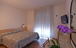 Postel nebo postele na pokoji v ubytování Hotel Prestige
