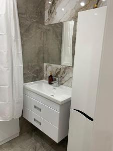 Koupelna v ubytování Лазурный квартал