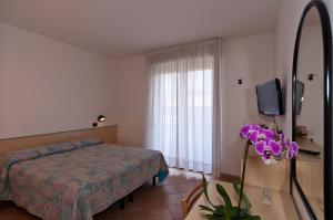 Postel nebo postele na pokoji v ubytování Hotel Prestige