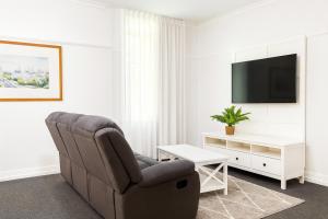 Μια τηλεόραση ή/και κέντρο ψυχαγωγίας στο Anzac Executive Apartments Brisbane +4 φωτογραφίες