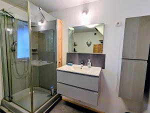 a bathroom with a sink and a shower at Chalet Mon Beau Sapin lisière de Forêt - Vue montagne - Gerardmer in Anould +75 photos