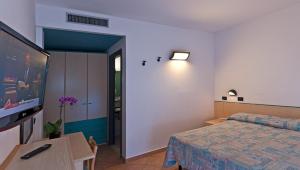 Postel nebo postele na pokoji v ubytování Hotel Prestige