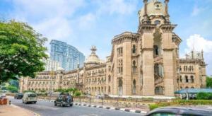 a large building with a clock tower on top of it at OYO 175 Lotus Hotel in Kuala Lumpur