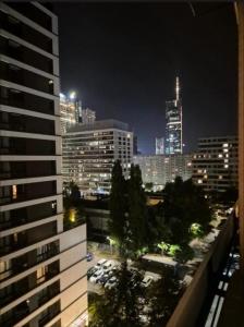a view of a city skyline at night at Warszawa Centrum Pokoje in Warsaw