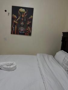 Postel nebo postele na pokoji v ubytování URBAN NEST HOMEs MACHAKOS