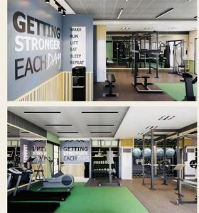 a gym with exercise equipment and a sign that reads getting stronger each day at AA Cozy Comfort in Nuvali in Calamba